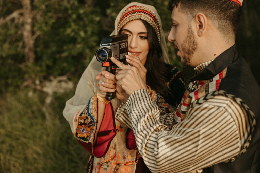 Couple taking Super8 vintage footage of themselves during engagement photos in the Columbia River Gorge