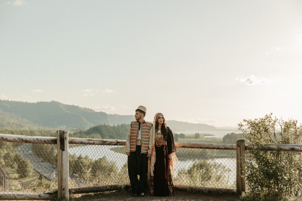 Outdoor engagement photos during sunset in the Columbia River Gorge Oregon. Couple wears traditional Palestinian and Syrian outfits