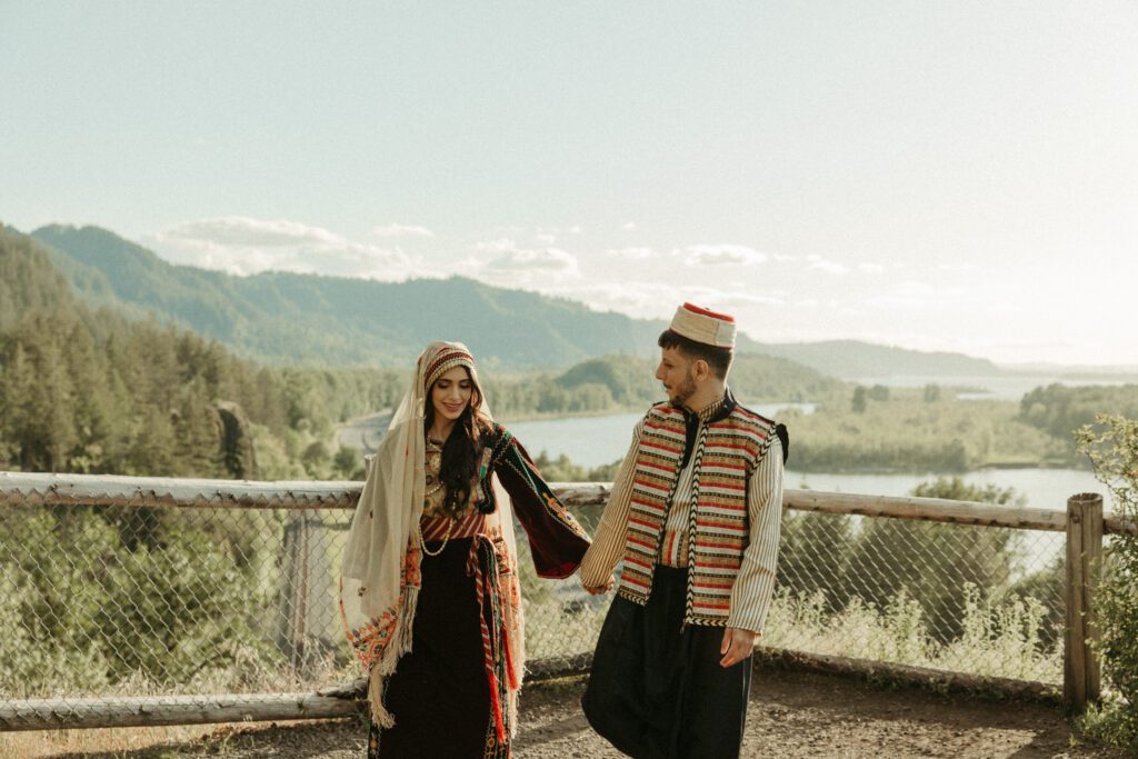 Outdoor engagement photos during sunset in the Columbia River Gorge Oregon. Couple wears traditional Palestinian and Syrian outfits