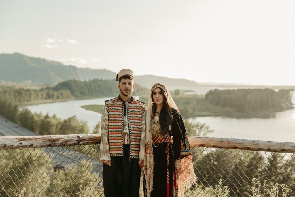 Outdoor engagement photos during sunset in the Columbia River Gorge Oregon. Couple wears traditional Palestinian and Syrian outfits