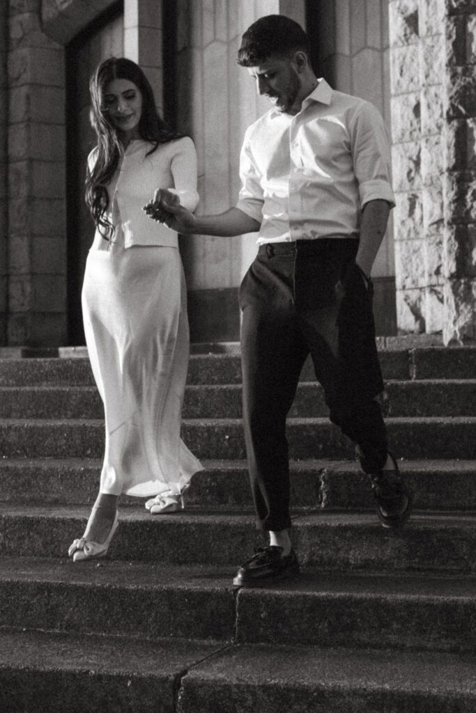 Candid and documentary golden hour engagement photos in the Columbia River Gorge, Oregon. Couple wears classic modern outfits